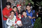 Rakhi Sawant spends Christmas with kids at home in Andheri, Mumbai on 24th Dec 2012 (4).JPG